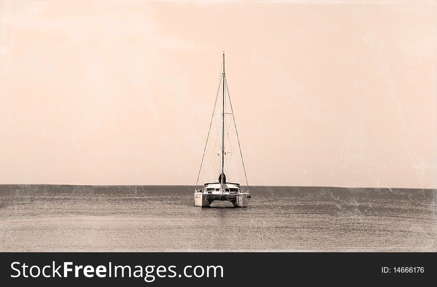 An alone catamaran at the sea. Sepia mode.