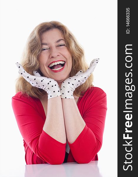 Portrait of a middle-aged woman in red with polka-dot gloves - isolated on white. Portrait of a middle-aged woman in red with polka-dot gloves - isolated on white