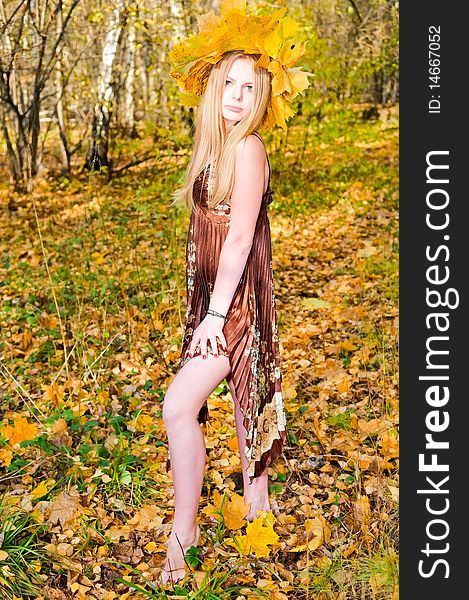 Girl In Autumn Forest
