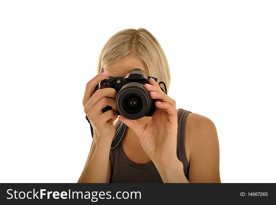 Young lady is making photo in studio by camera. Young lady is making photo in studio by camera