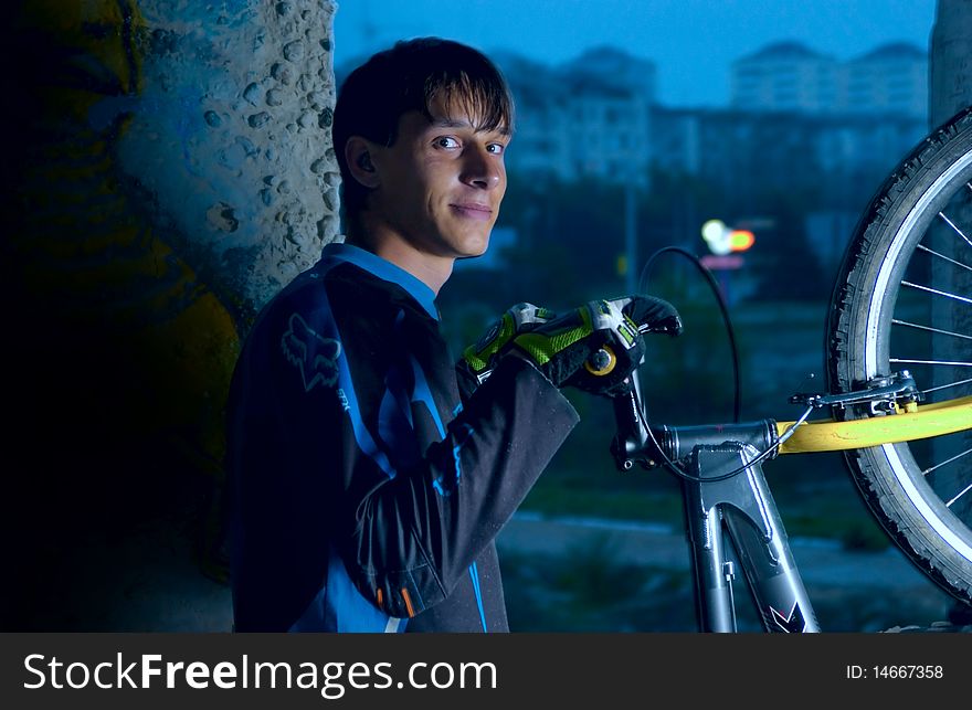 Bike trialist before riding an urban night. Bike trialist before riding an urban night