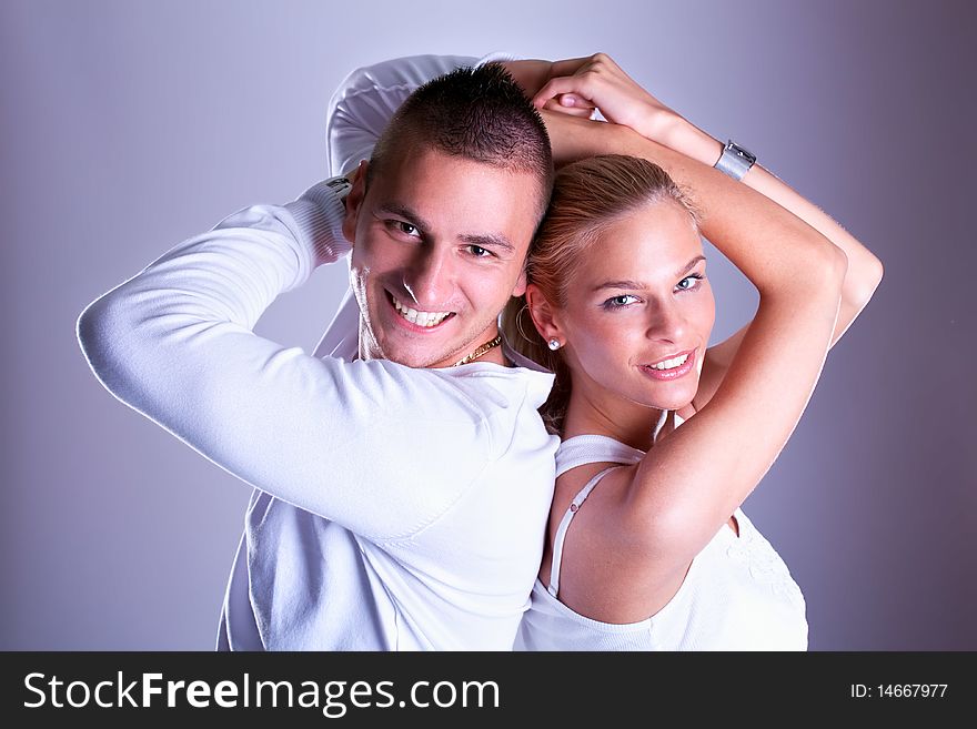 Happy Young loving couple hugging and smile