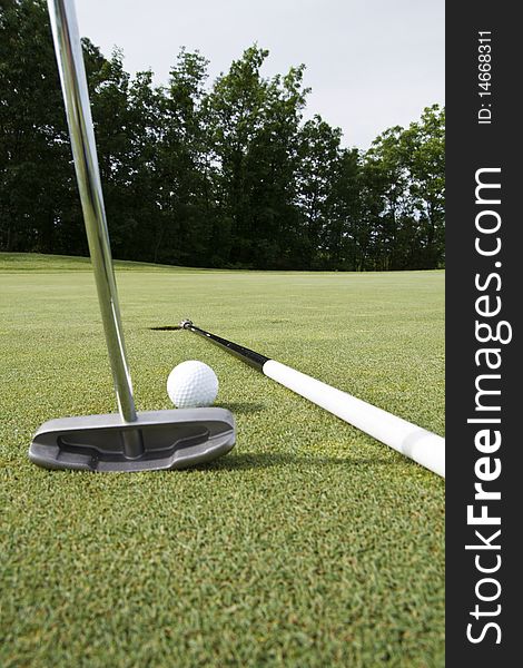 Laying the flagstick to help your putt is illegal. Laying the flagstick to help your putt is illegal