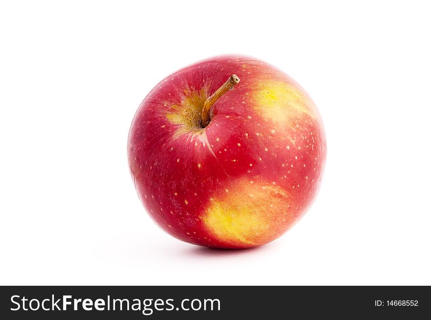 Red and yellow apple with a drop a shadow in white background