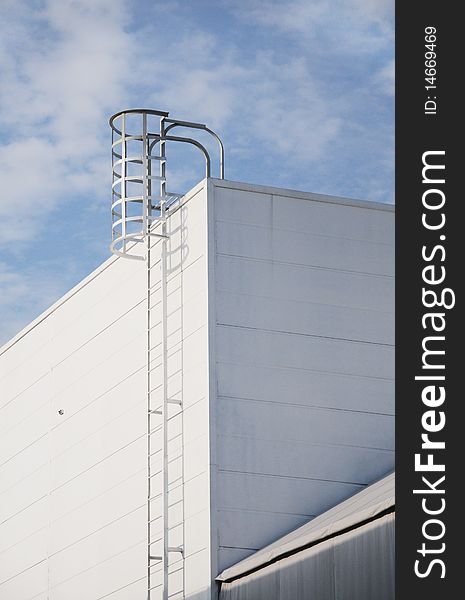 The steel ladder on a modern building. The steel ladder on a modern building.