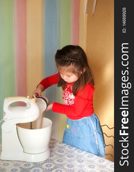 Girl helps her mother in cooking apple pie. Girl helps her mother in cooking apple pie