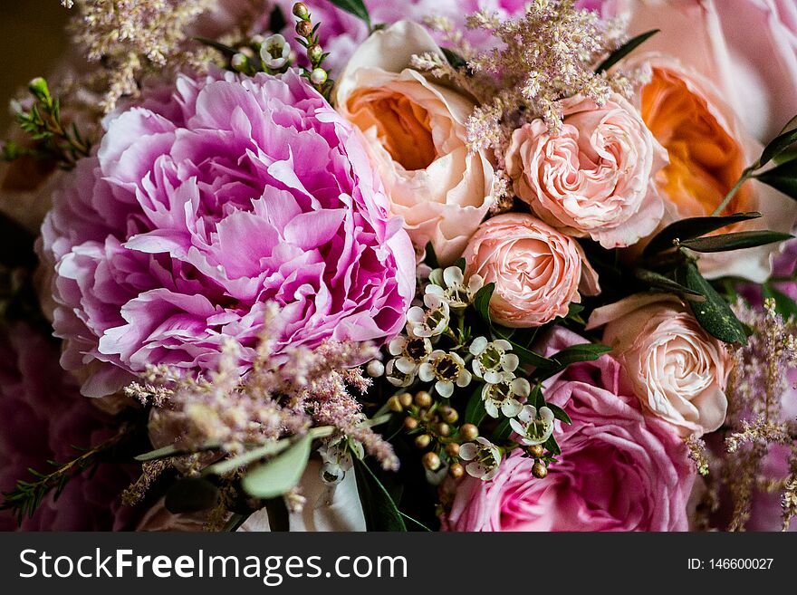 Pink roses and peonies in a bouquet