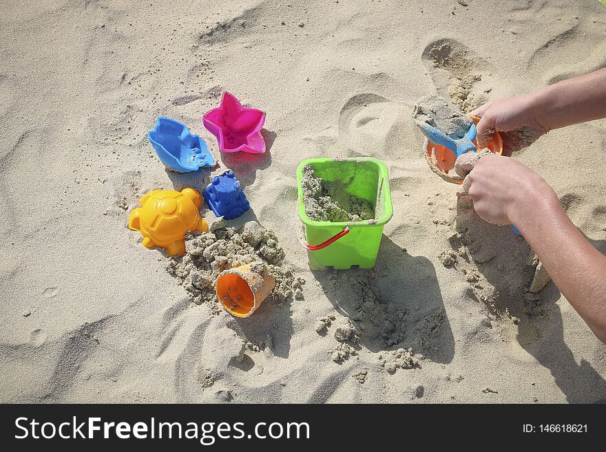 Children`s Toys On The Sandy Beach