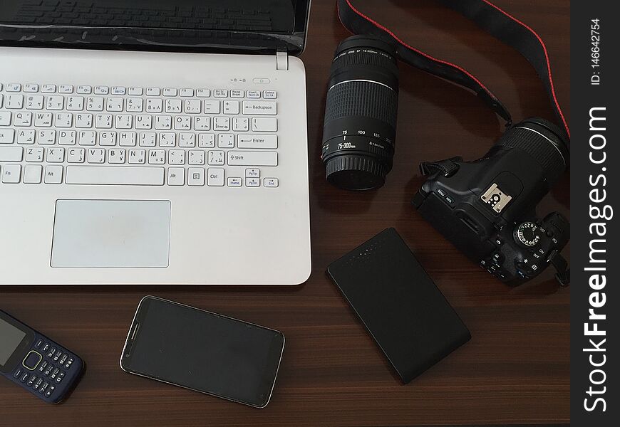 Work desk with laptop and camera