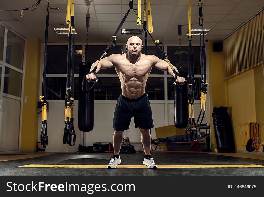 Man bodybuilder perform exercise