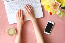 Female Hands Over Textured Table With Flowers And Electronic Devices Royalty Free Stock Photography Female Hands Over Textured Table With Flowers And Electronic Devices Royalty Free Stock Photography