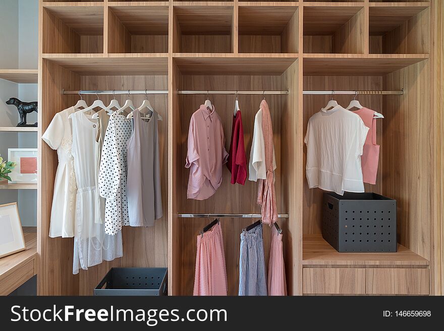 modern closet with clothes hanging