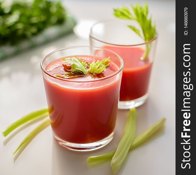 Tomato Juice In Glasses With Greens