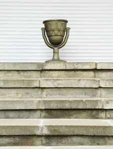 Old Urn On A Ladder, On A White Background Royalty Free Stock Image Old Urn On A Ladder, On A White Background Royalty Free Stock Image