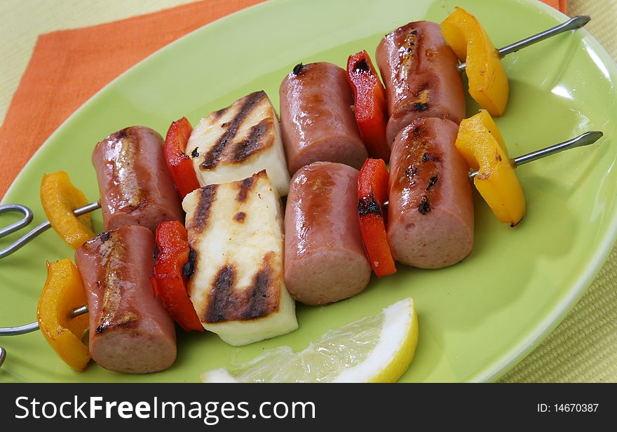 Frankfurter sausage sticks barbecue with vegetables. Frankfurter sausage sticks barbecue with vegetables