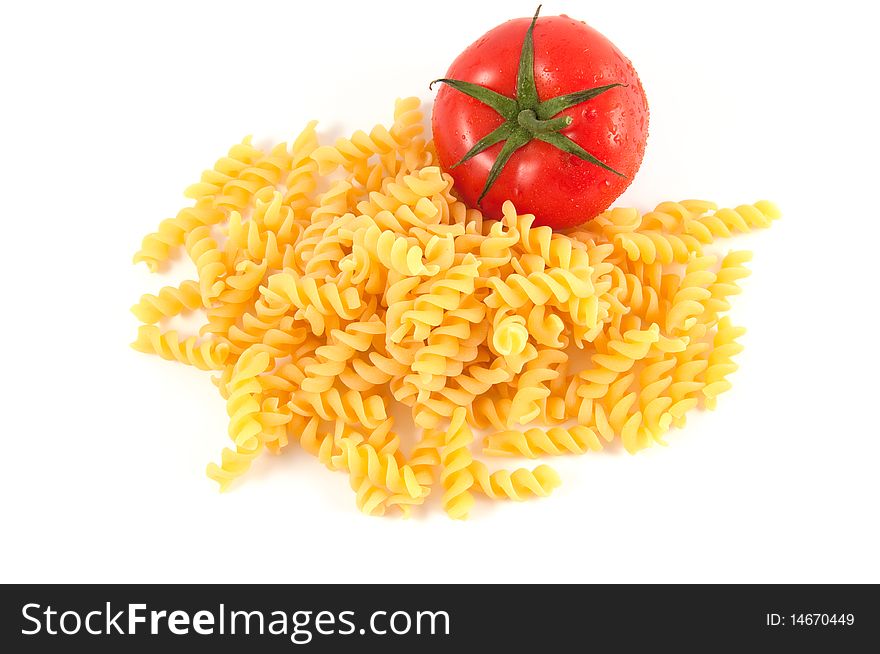 Italian pasta fusilli and tomatoes on white background