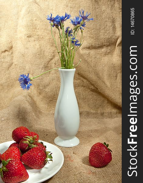 Fresh strawberry and vase with flowers. Fresh strawberry and vase with flowers