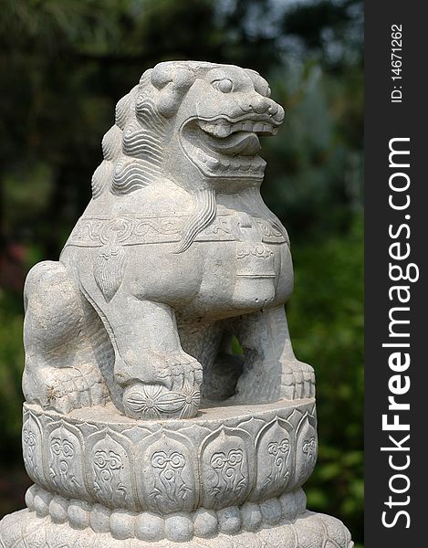 A stone carving of the ancient oriental lion. A stone carving of the ancient oriental lion