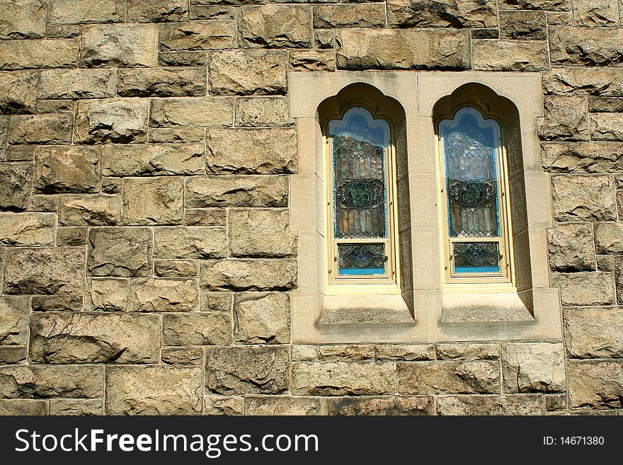 Stone wall with stained glass windows