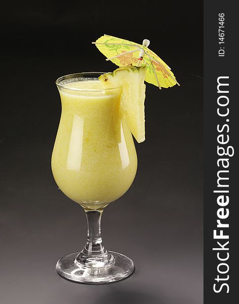 Tasty alcohol cocktail with pineapple