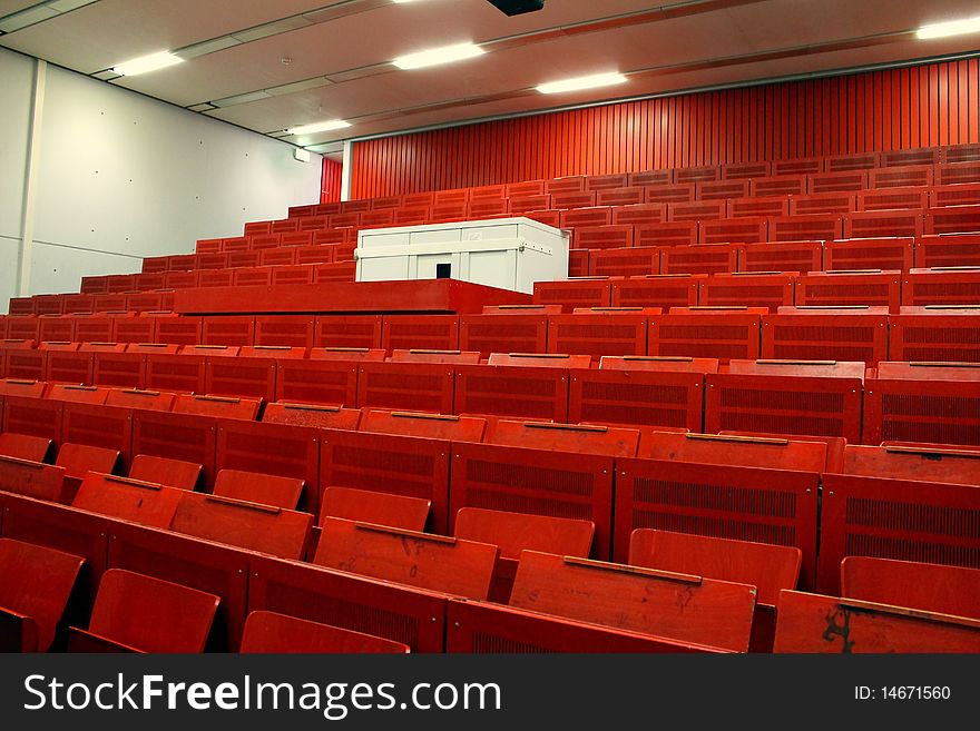 Some red seats in a lecture hall. Some red seats in a lecture hall