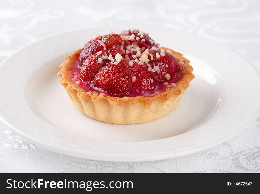 Strawberry cake on white plate