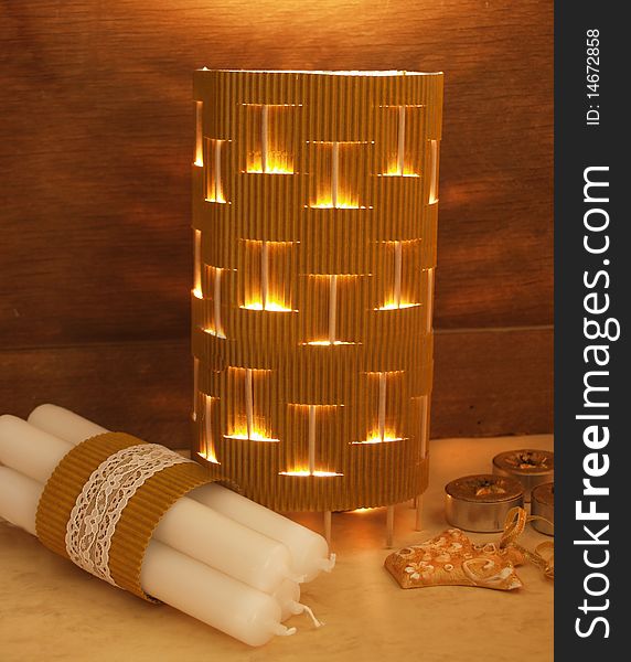Close up of cardboard lamp with candles