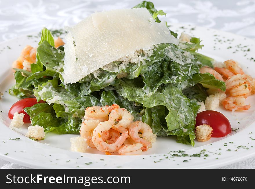 Salad caesar with shrimps on plate. Salad caesar with shrimps on plate