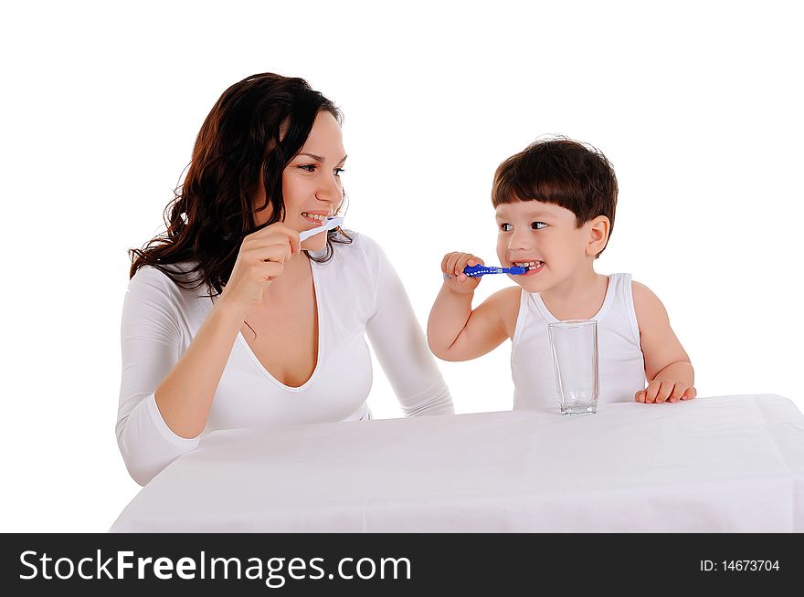 Young mother and the little boy brushing teeth. Young mother and the little boy brushing teeth