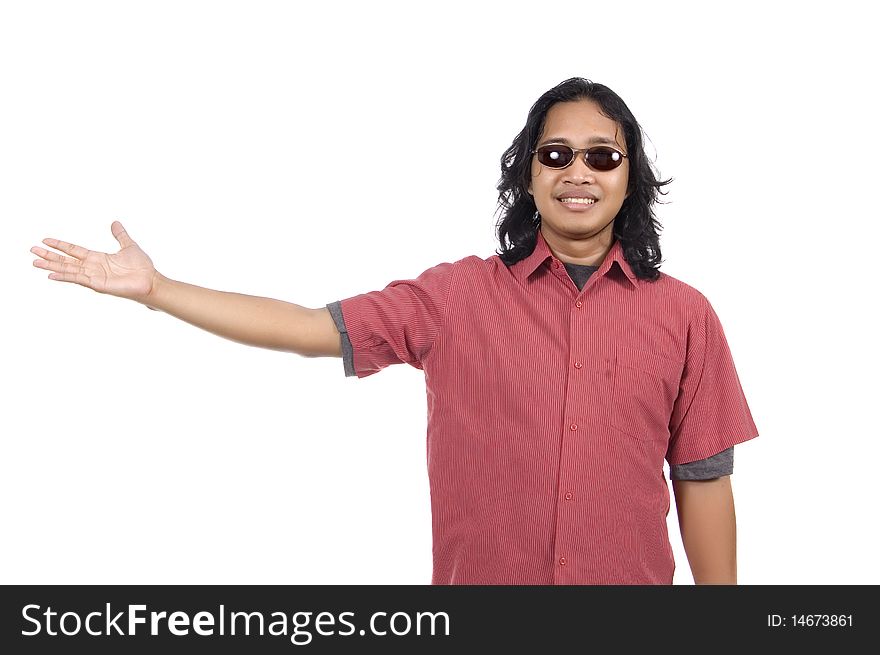 Long hair man with sunglasses pointing something isolated on white background