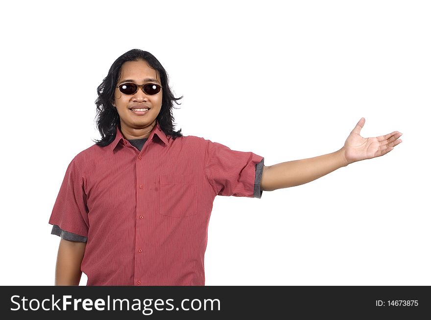 Long hair man with sunglasses pointing something isolated on white background
