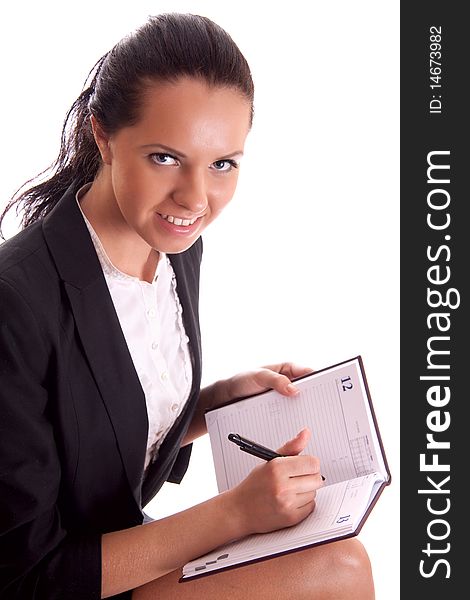 Woman with pen and datebook on white background isolated