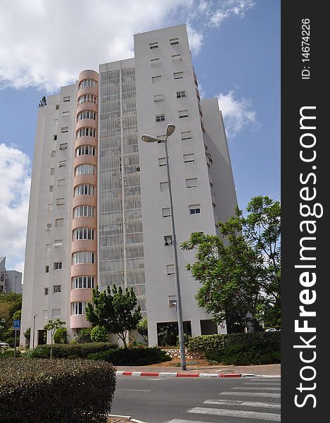 Front view urban apartment building with close balconies . Front view urban apartment building with close balconies .