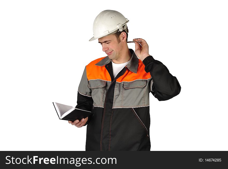The chief engineer in a helmet writes in a notebook on a white background