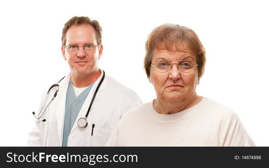 Concerned Senior Woman with Male Doctor Behind Isolated on a White Background. Concerned Senior Woman with Male Doctor Behind Isolated on a White Background.