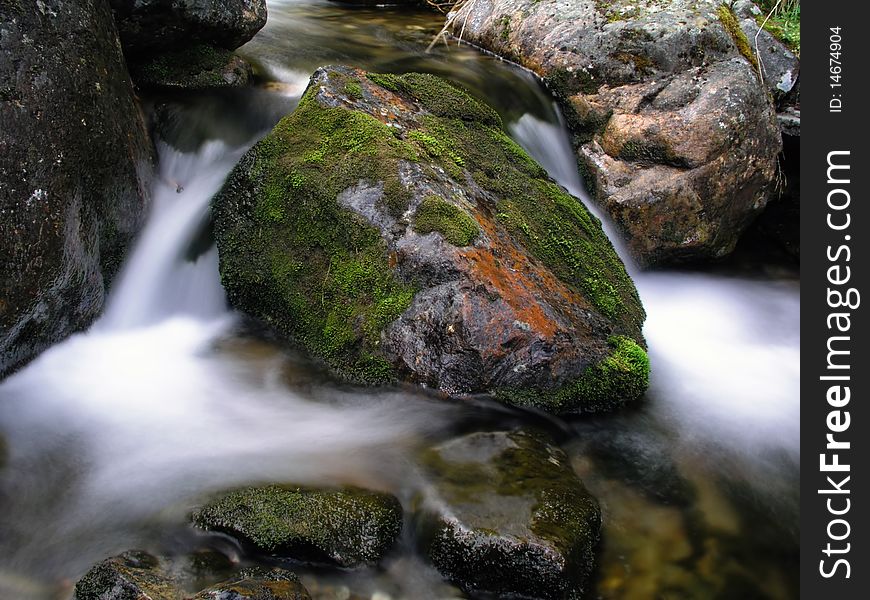 Beautiful flowing water of mountain stream