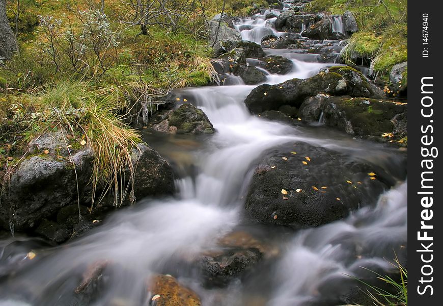 Beautiful landscape of flowing water from mountain stream. Beautiful landscape of flowing water from mountain stream