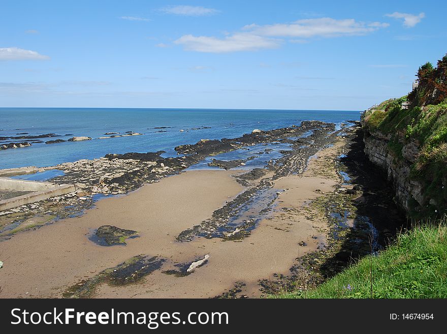 The tide is out around the Fife coast, revealing small areas of sandy beach. The tide is out around the Fife coast, revealing small areas of sandy beach