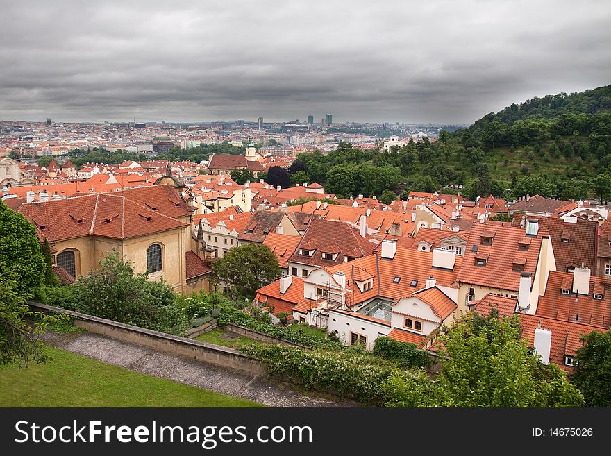 Red roofs of Prague and dark sky