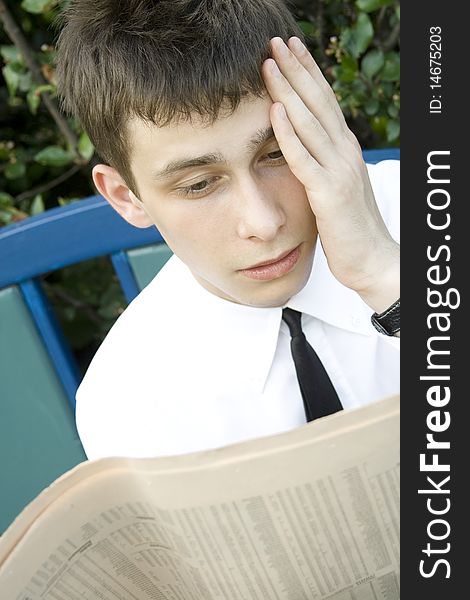 Young Man Reading Newspaper