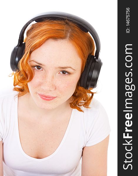 Redhead gilr with headphones isolated on white