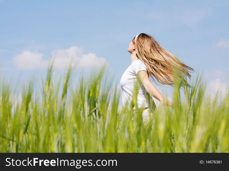 Young Girl In Green Field