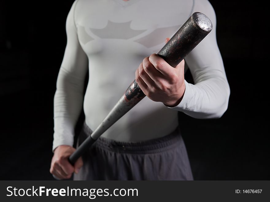 Torso of a guy holding a baseball bat