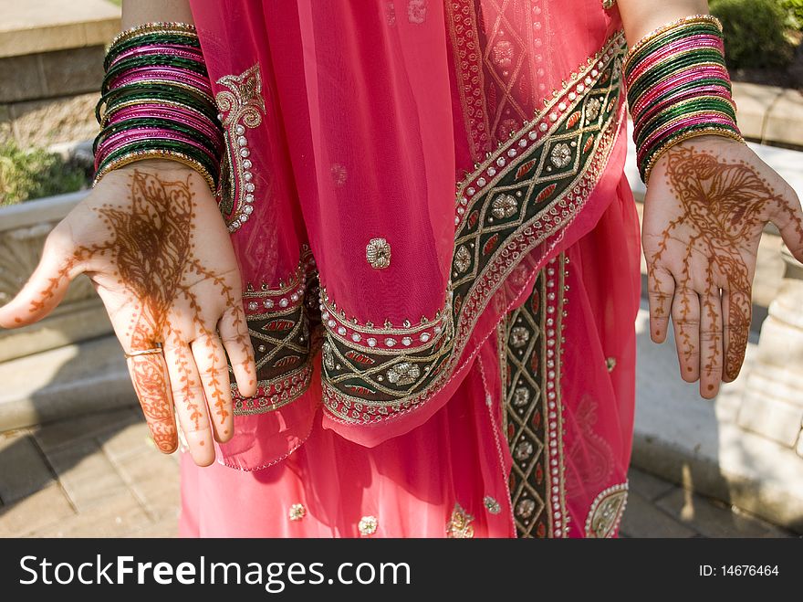 Young indian woman showing her hand with henna on it. Young indian woman showing her hand with henna on it