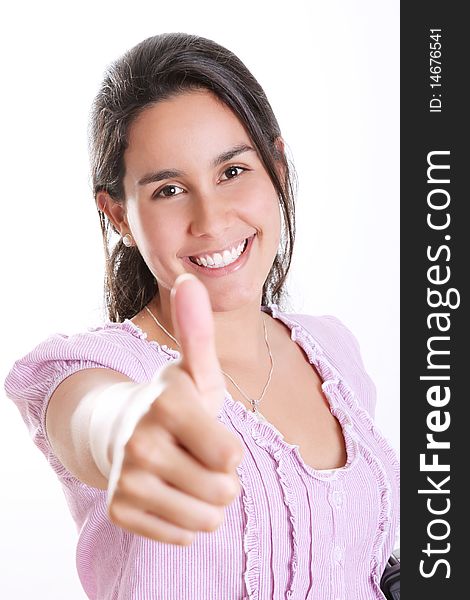 Young girl smiling and looking at the camera making ok sign with his hand