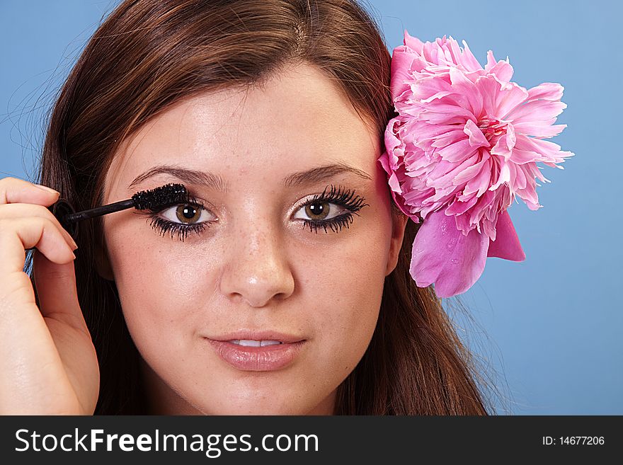 Fresh faced beauty putting on makeup