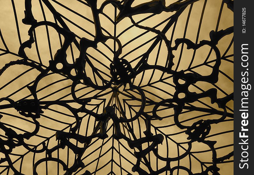 Iron hand forged canopy shot from below making a beautiful abstract pattern. Iron hand forged canopy shot from below making a beautiful abstract pattern.