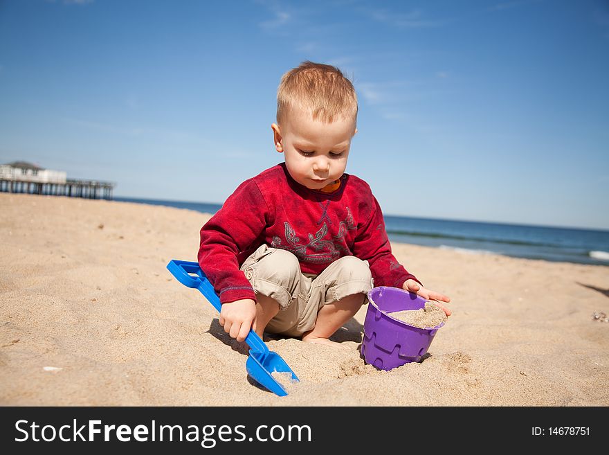 Small boy playing at the beach