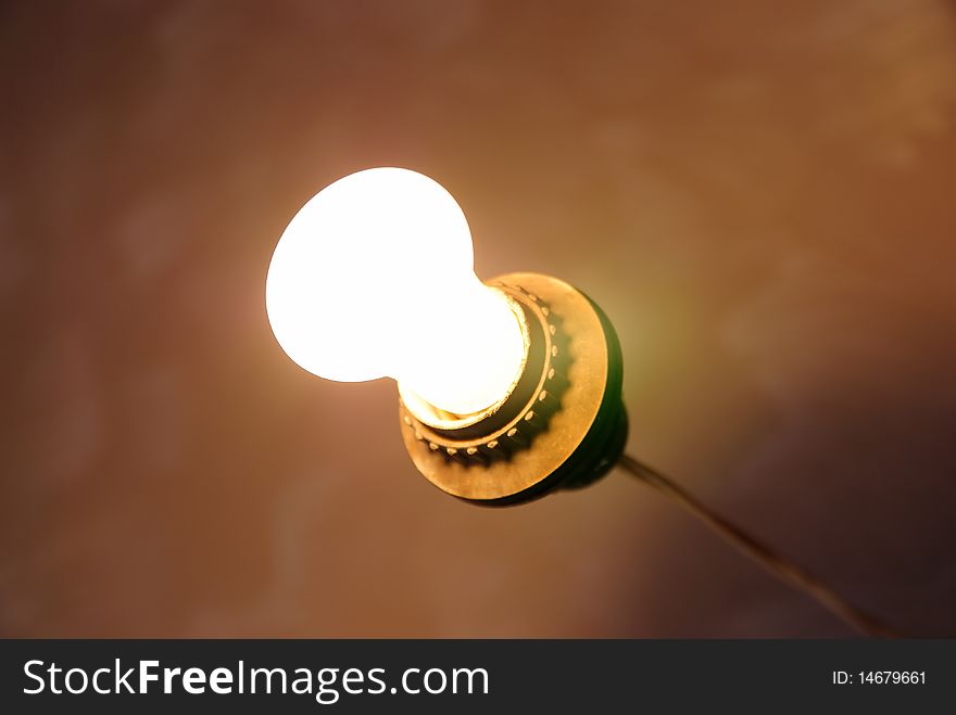 Bright bulb on a yellow background. Bright bulb on a yellow background
