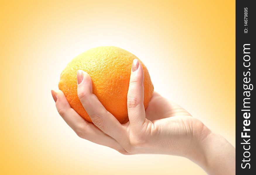 Image of a tasty orange in a human hand